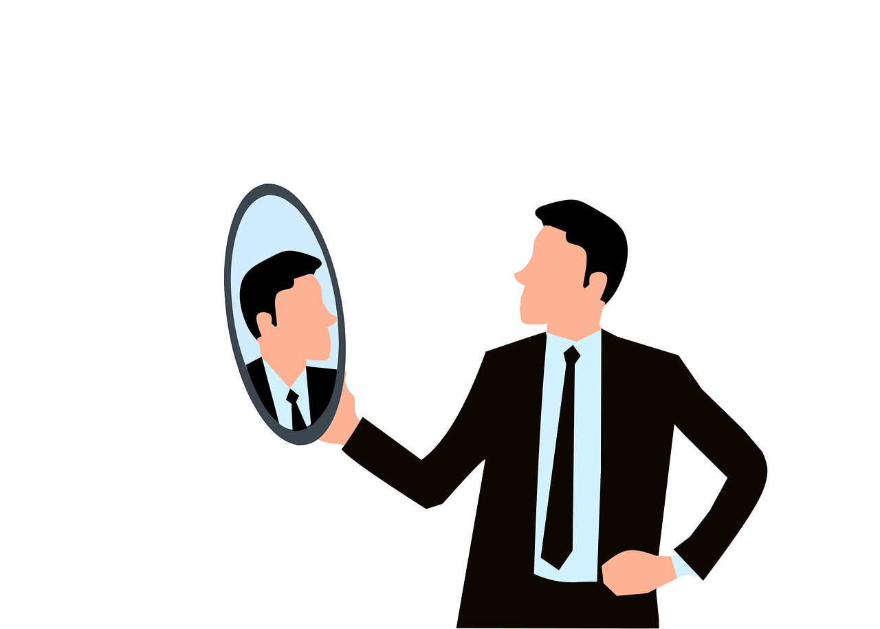 Persona mirándose  a un espejo